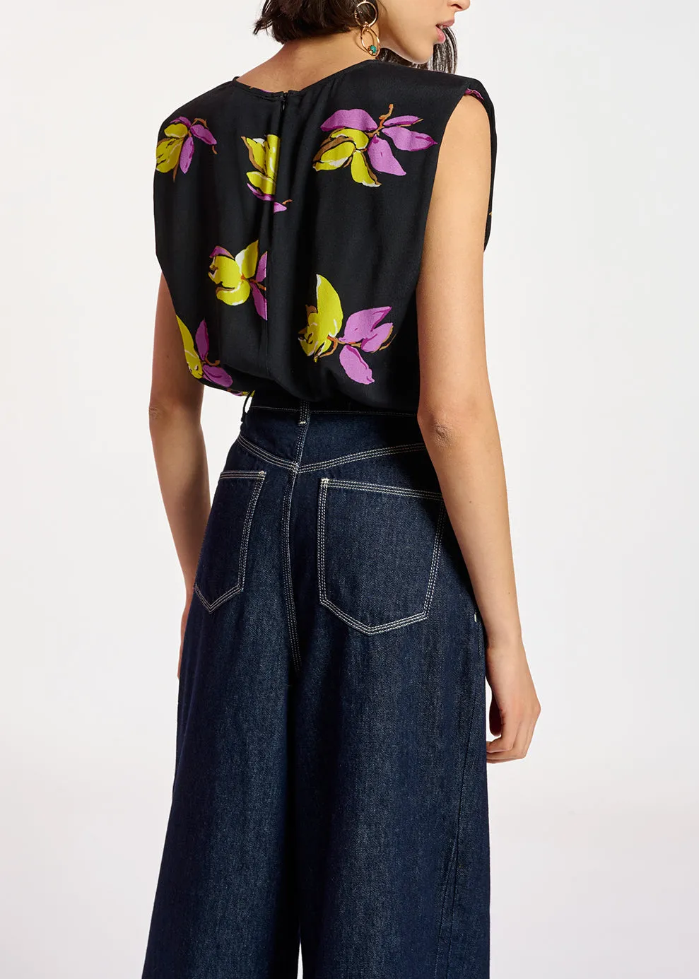 Black floral-print sleeveless top with padded shoulders